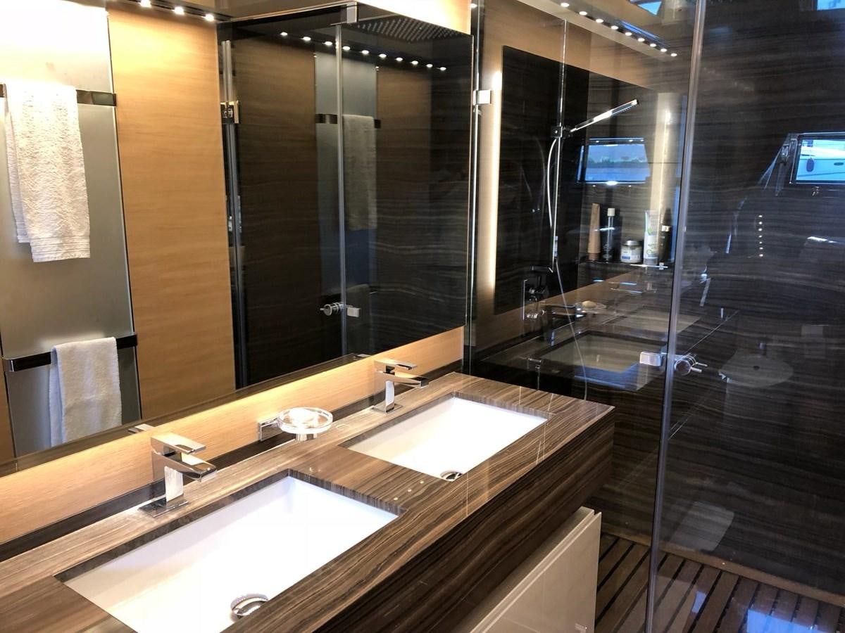 a bathroom with a large mirror aboard VISIONARIA Yacht for Sale