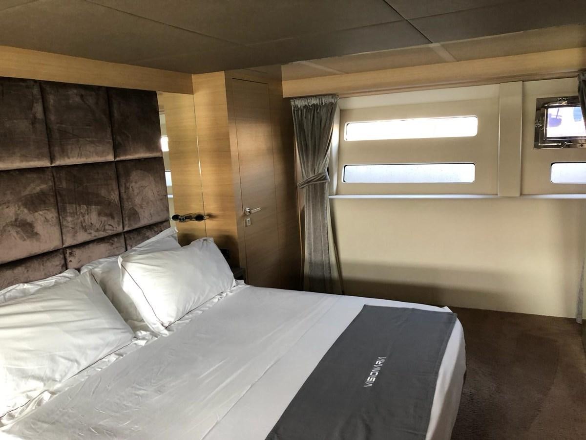 a hotel room with a bed aboard VISIONARIA Yacht for Sale