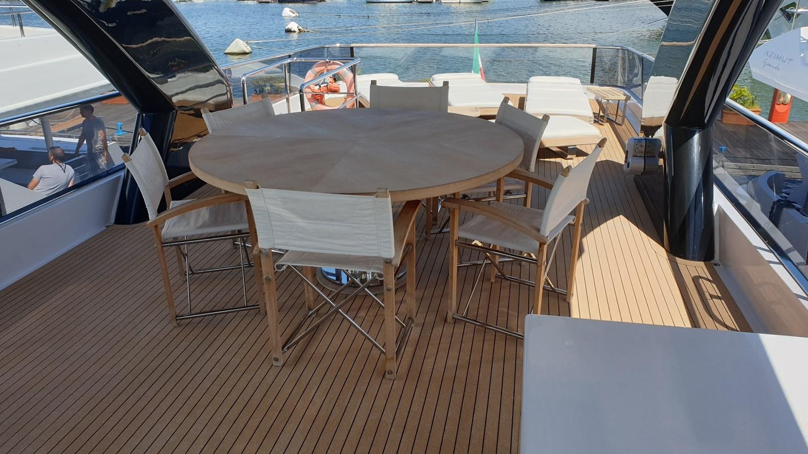 a boat with tables and chairs aboard VISIONARIA Yacht for Sale