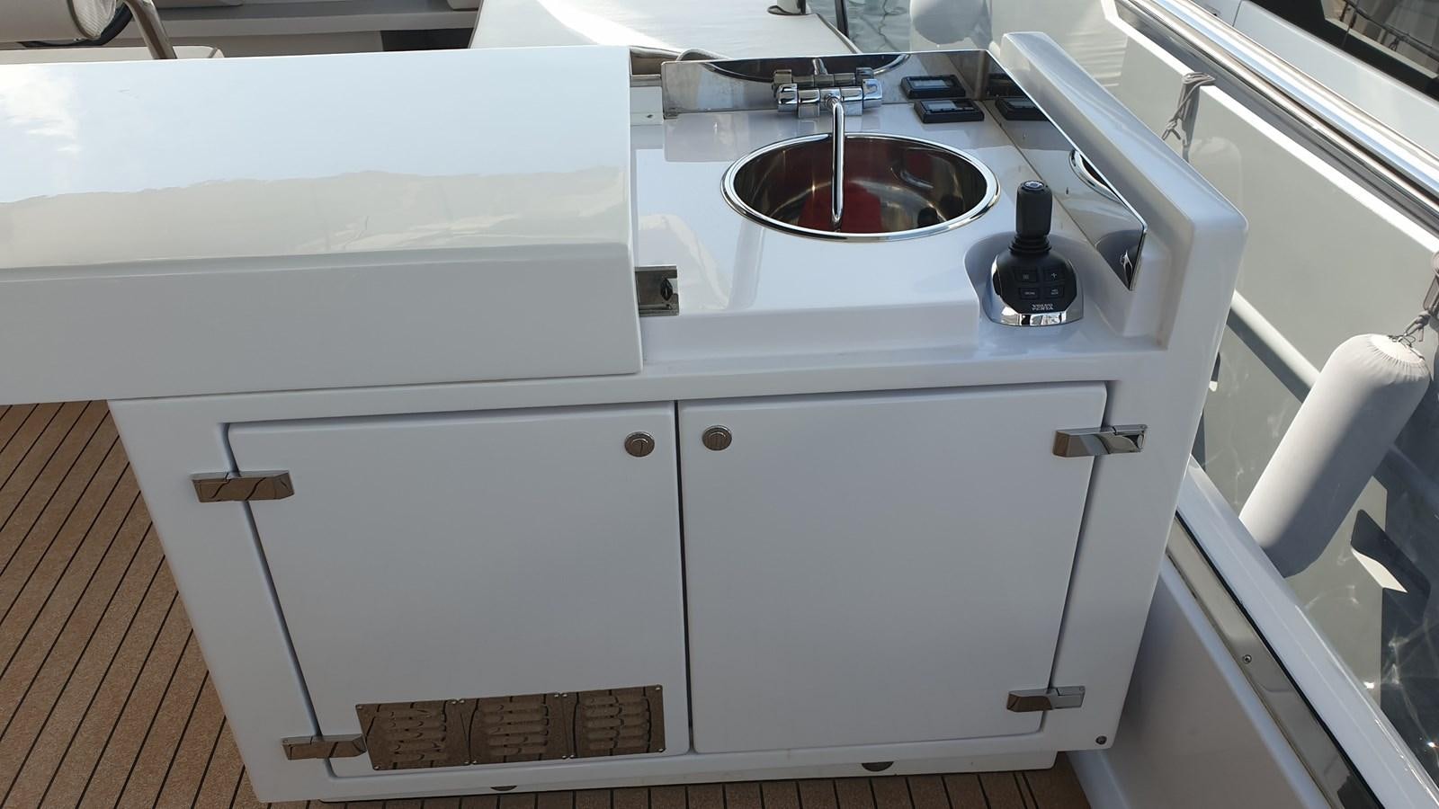 a white cabinet with a sink aboard VISIONARIA Yacht for Sale