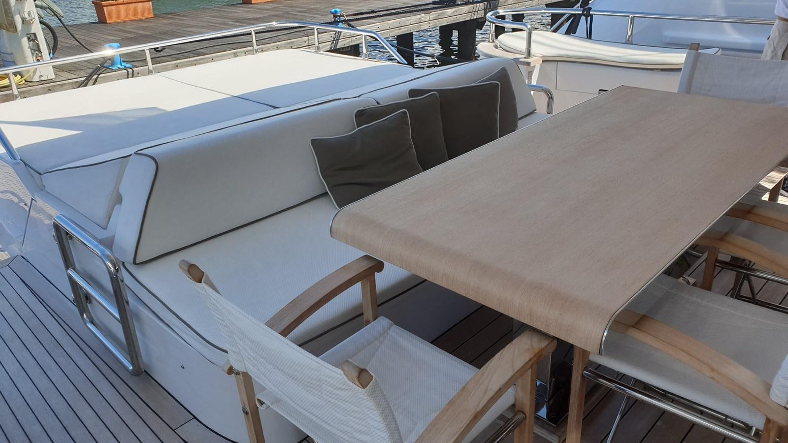 a wooden table on a boat aboard VISIONARIA Yacht for Sale