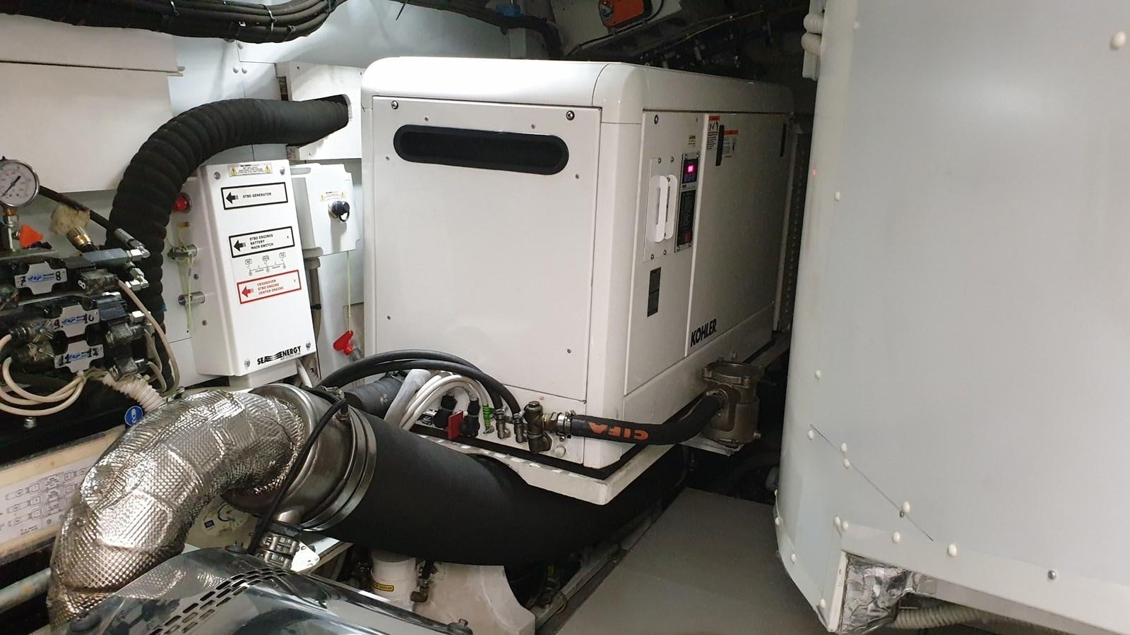 a machine with a large metal cylinder aboard VISIONARIA Yacht for Sale