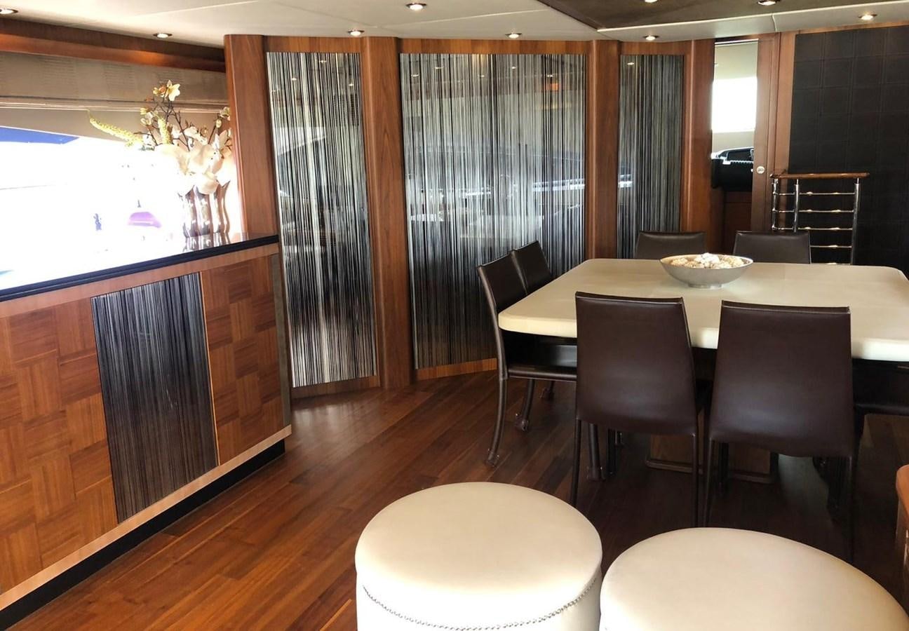 a dining room with a table and chairs aboard MI ALMA Yacht for Sale