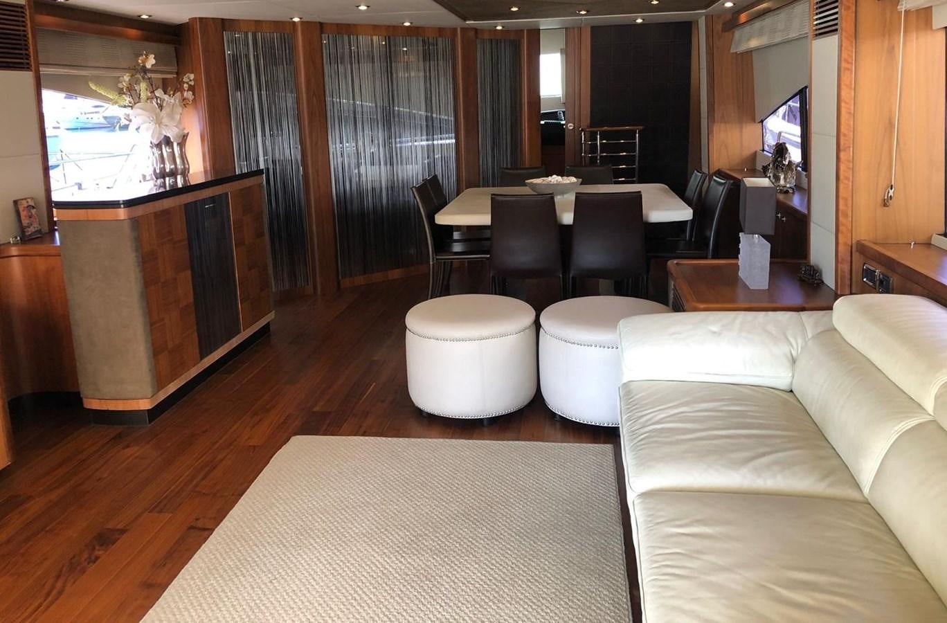 a living room with a wood floor aboard MI ALMA Yacht for Sale