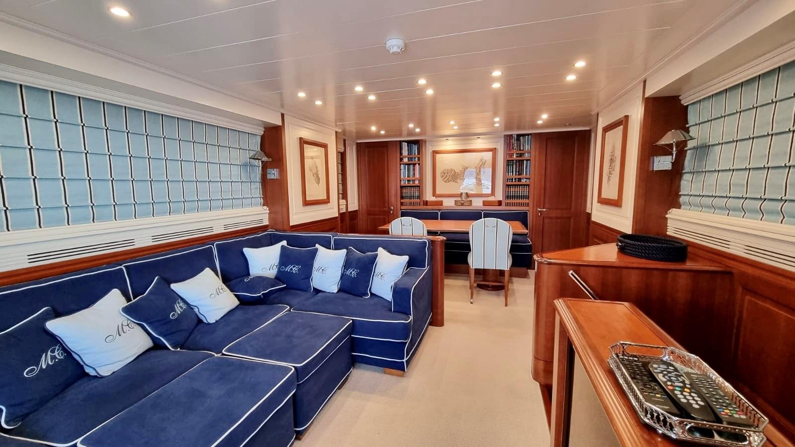 a room with a bed and a desk aboard M.C Yacht for Sale