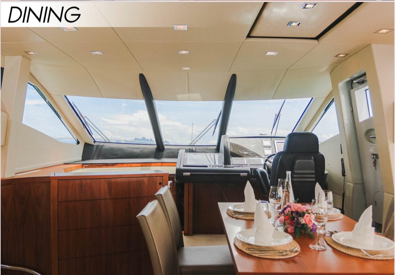 a room with a table and chairs aboard FARA Yacht for Sale