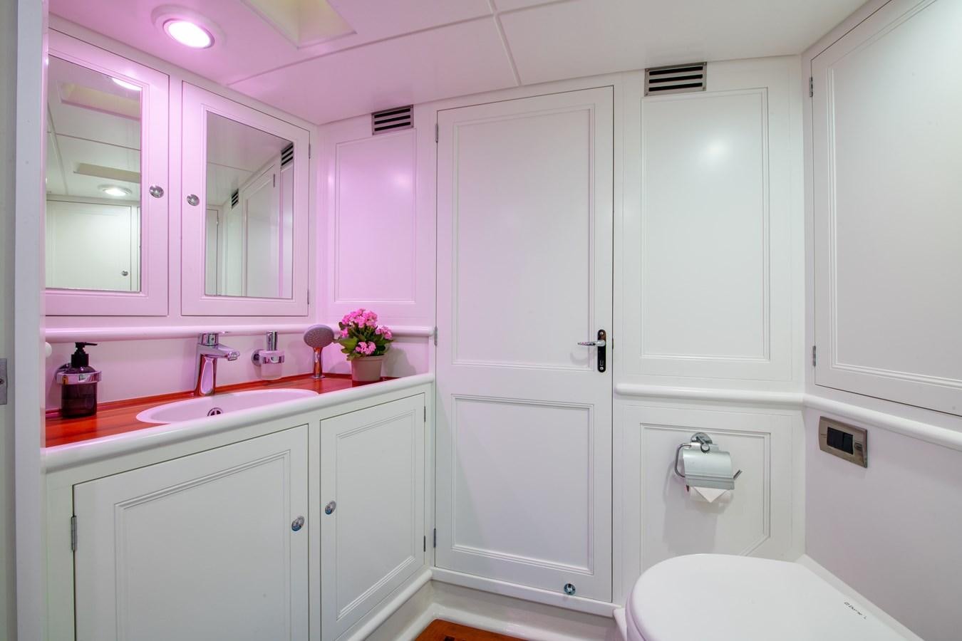 a bathroom with a sink and cabinets aboard AMOENITAS Yacht for Sale