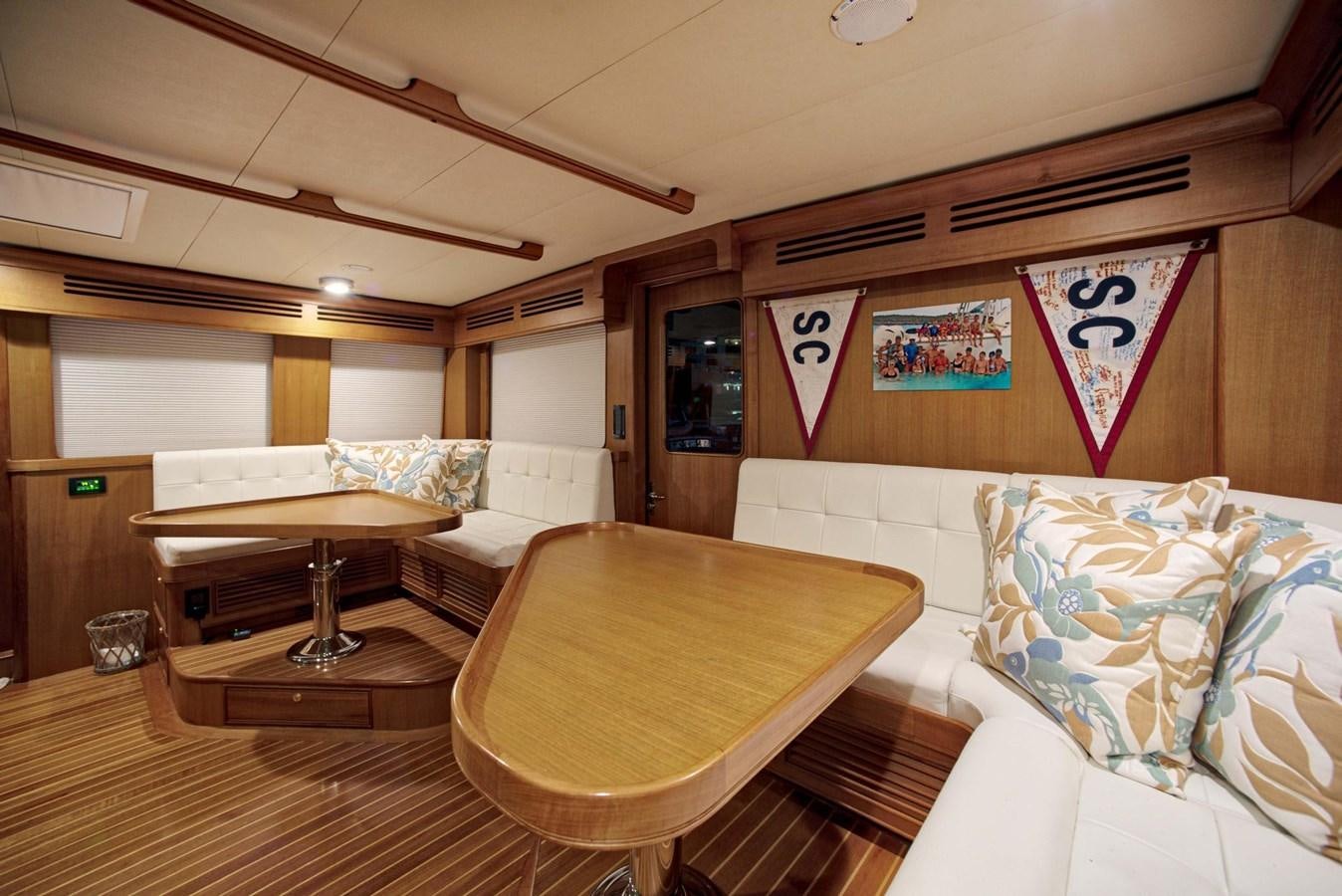 a room with a bed and a table aboard BEACH TO BEACH Yacht for Sale