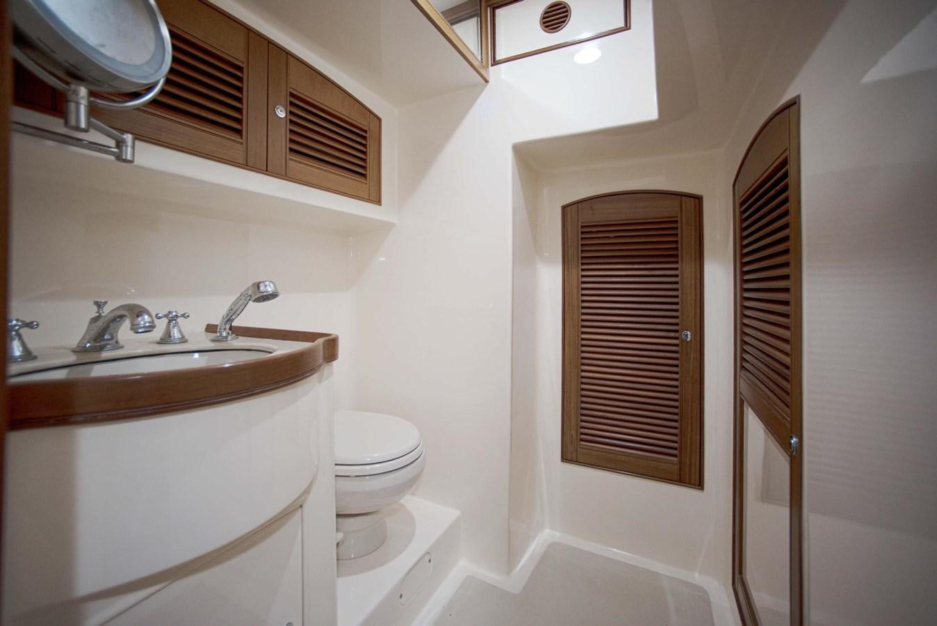 a bathroom with a sink and a toilet aboard BEACH TO BEACH Yacht for Sale