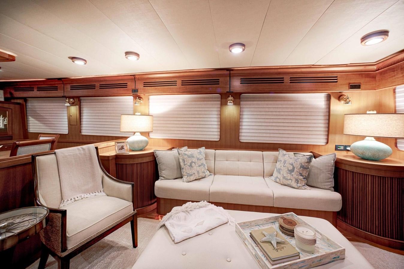 a living room with a couch and a table aboard BEACH TO BEACH Yacht for Sale