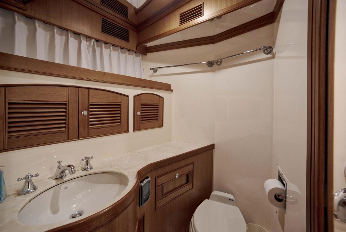 a bathroom with a sink and a toilet aboard BEACH TO BEACH Yacht for Sale