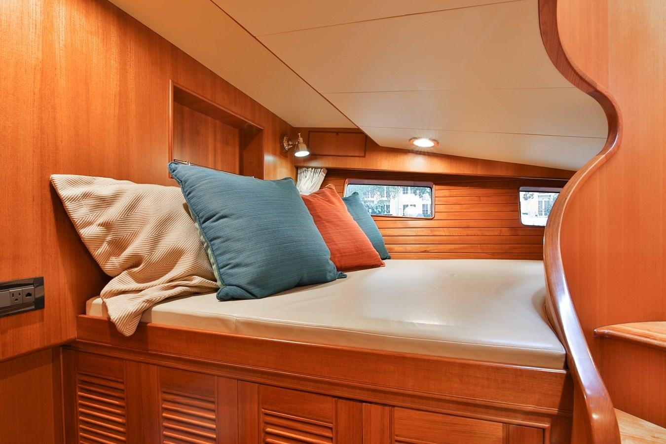 a bed with pillows aboard FREQUENT SEA Yacht for Sale