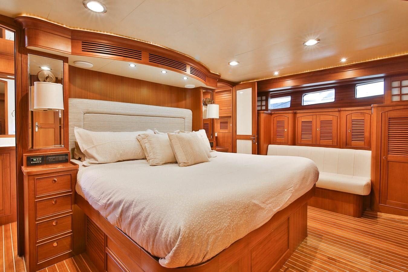 a large bed in a room aboard FREQUENT SEA Yacht for Sale