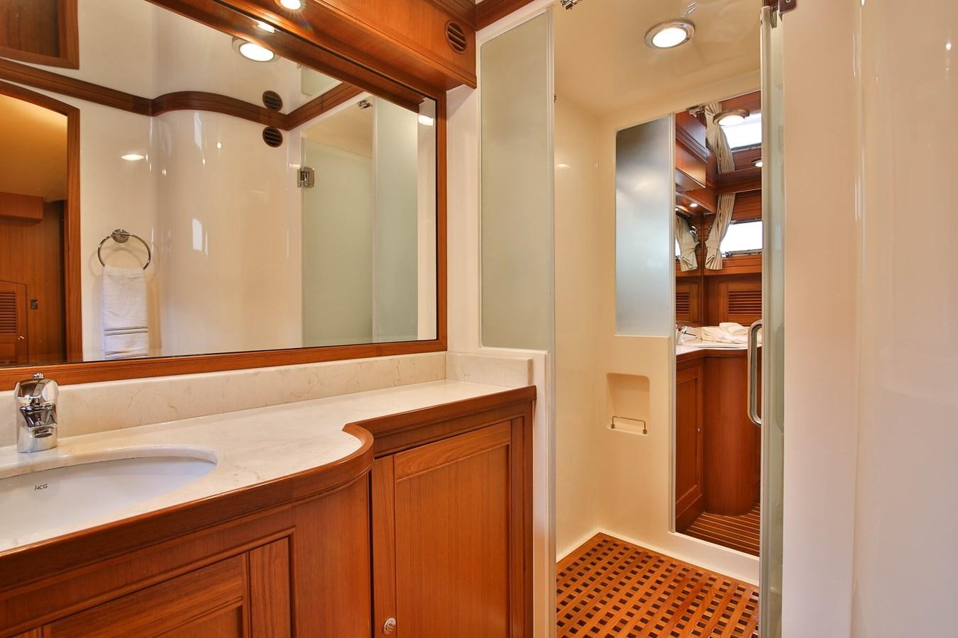 a bathroom with a large mirror aboard FREQUENT SEA Yacht for Sale