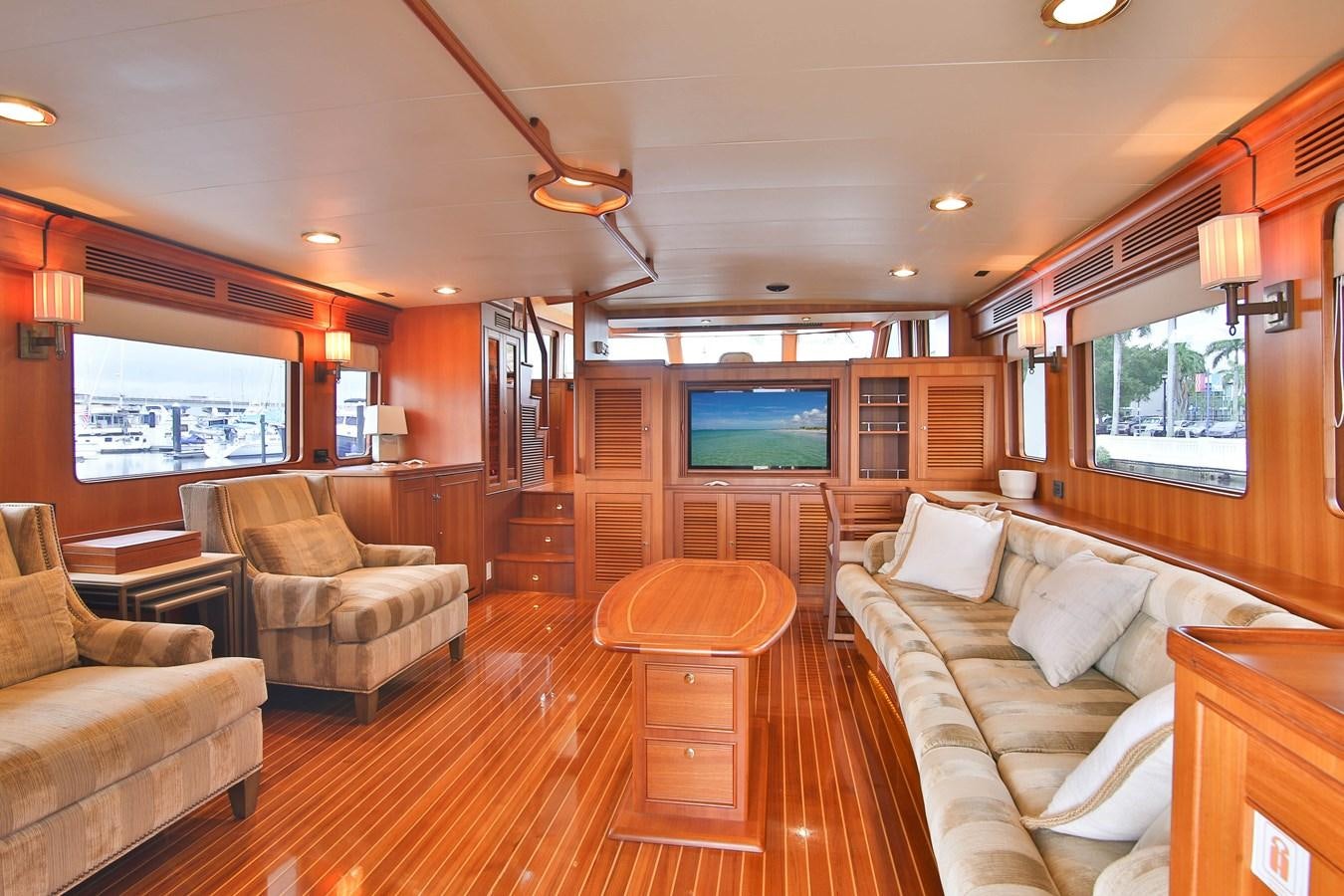 a living room with a wood floor aboard FREQUENT SEA Yacht for Sale