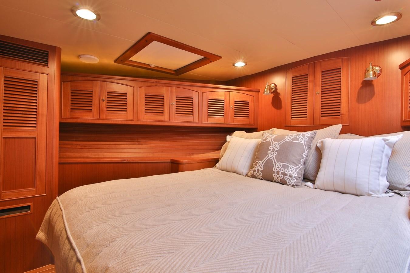a bed with white sheets aboard FREQUENT SEA Yacht for Sale