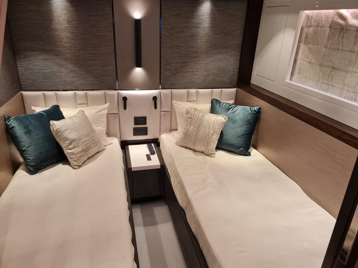 a room with a bed and a microwave aboard CANDY Yacht for Sale