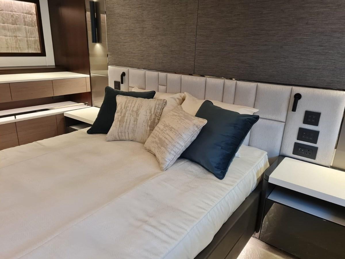 a bed with white sheets aboard CANDY Yacht for Sale