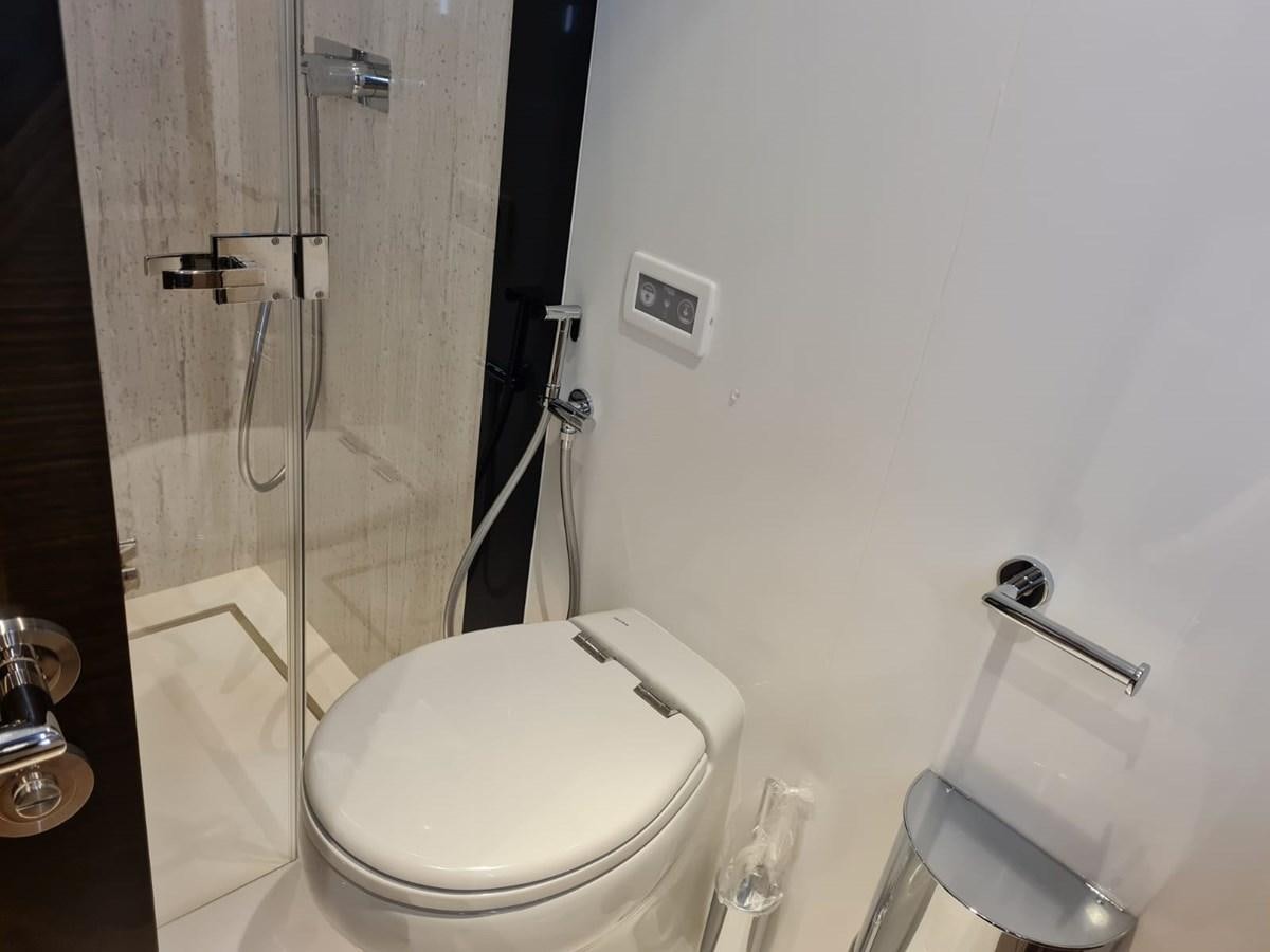 a bathroom with a glass shower aboard CANDY Yacht for Sale