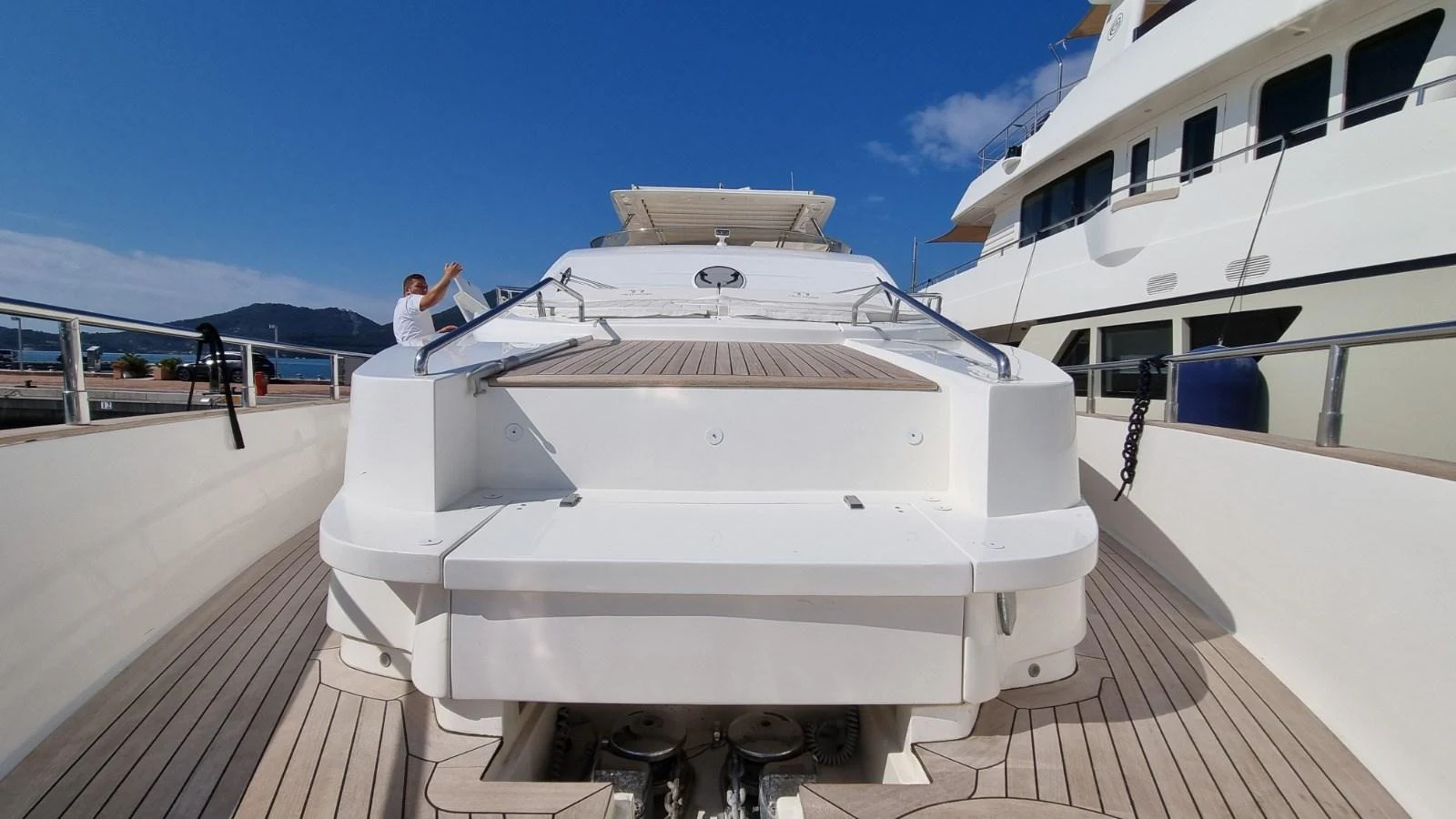 a person standing on a boat aboard RED ROSE Yacht for Sale