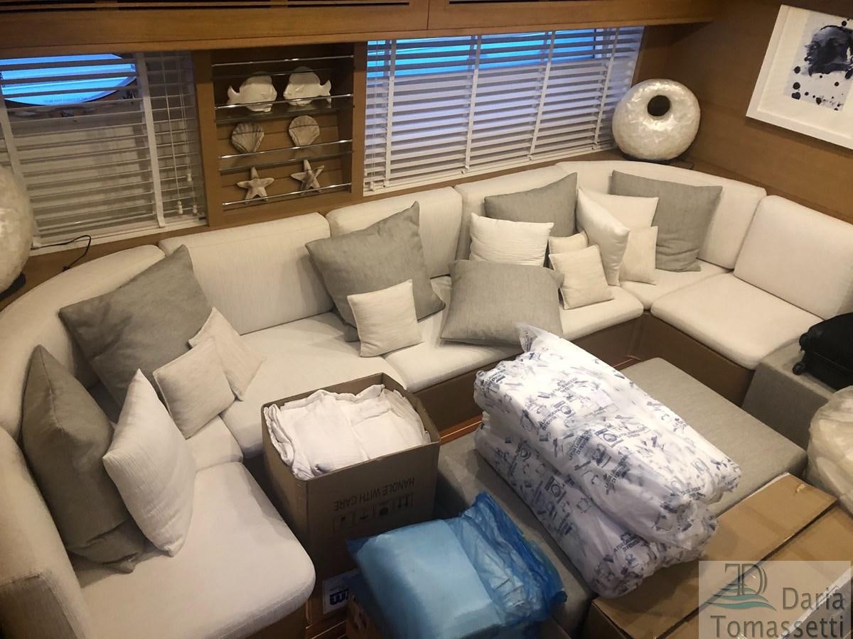 a living room with a couch and a shelf aboard FB Yacht for Sale