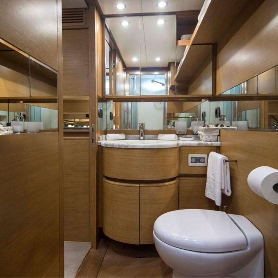 a bathroom with a toilet and sink aboard FB Yacht for Sale