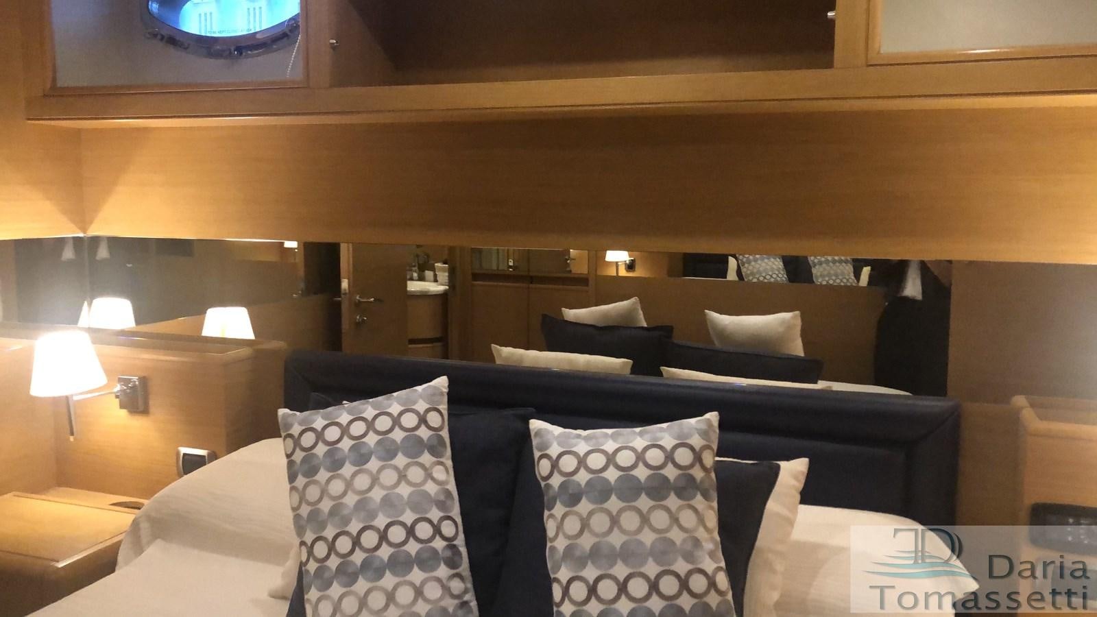 a bed with pillows aboard FB Yacht for Sale