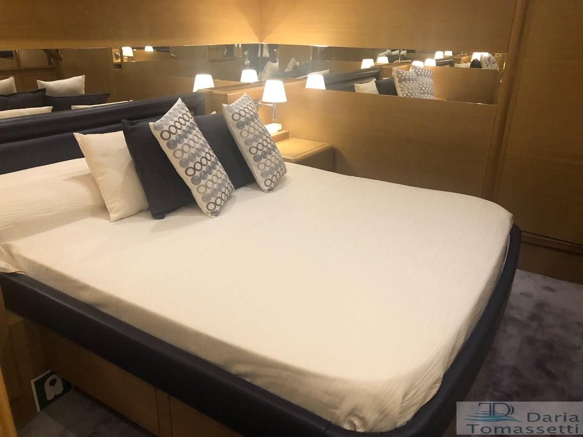 a bed with pillows aboard FB Yacht for Sale