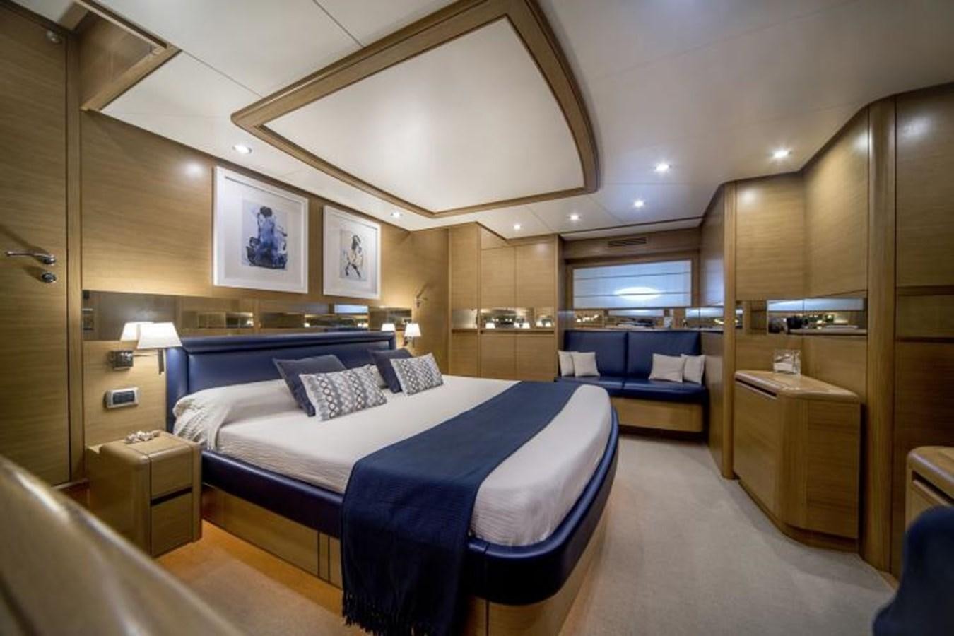 a room with a bed and a table aboard FB Yacht for Sale
