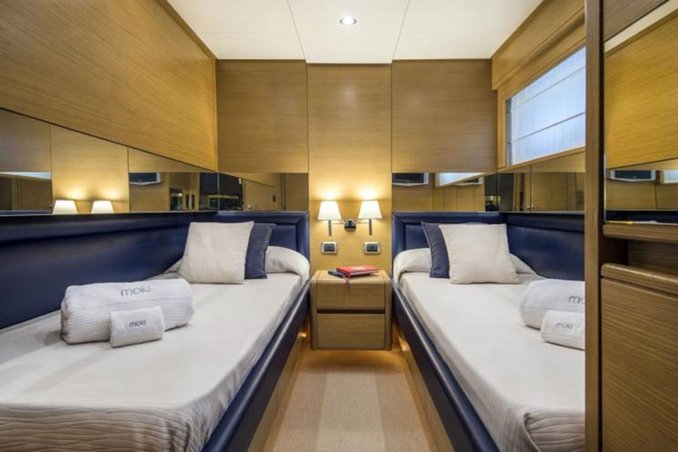 a room with two beds aboard FB Yacht for Sale