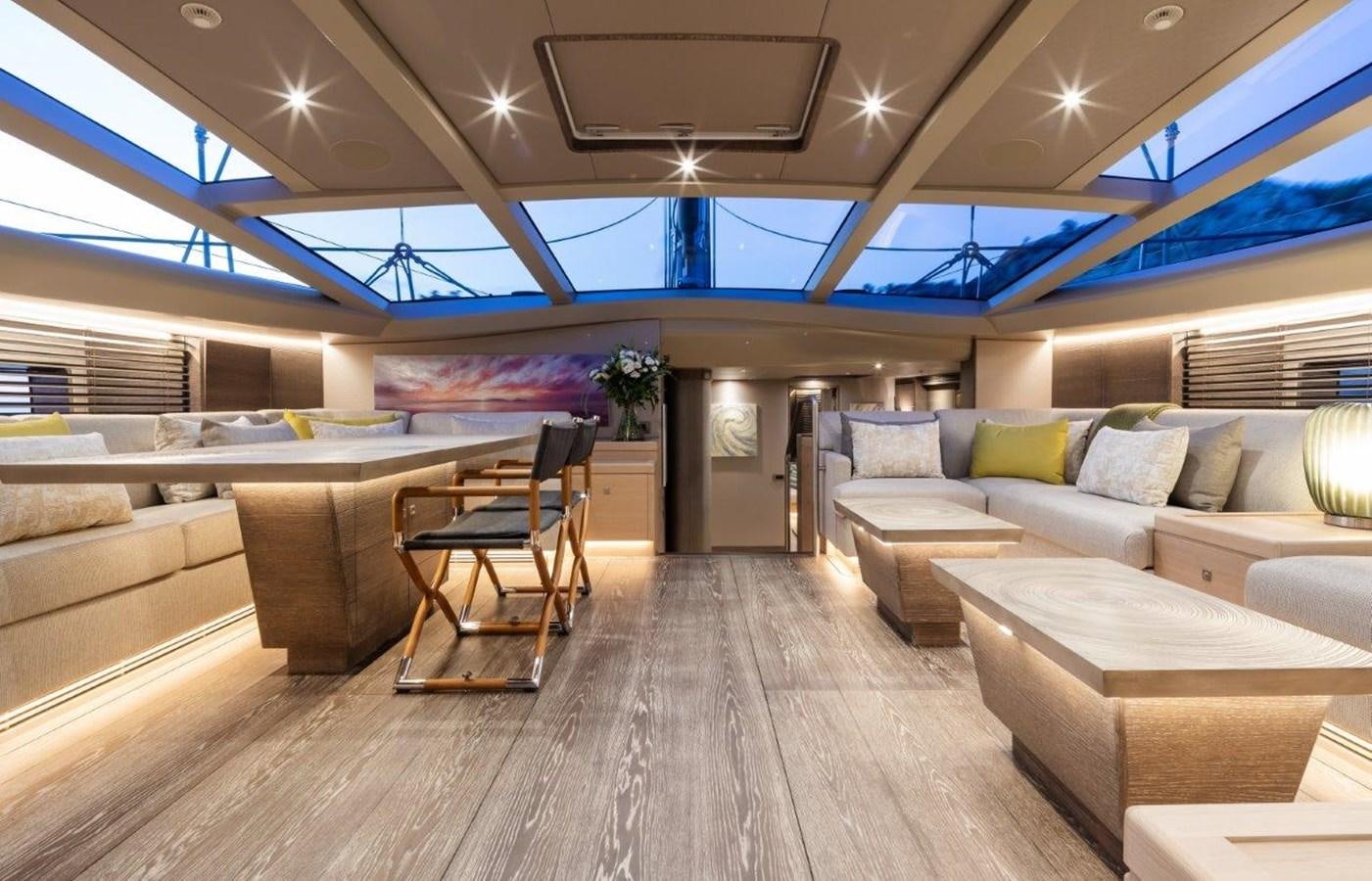 a room with a couch and a table aboard ALICE Yacht for Sale