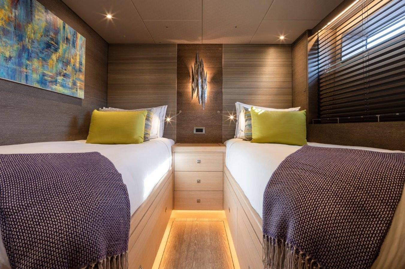 a room with two beds aboard ALICE Yacht for Sale