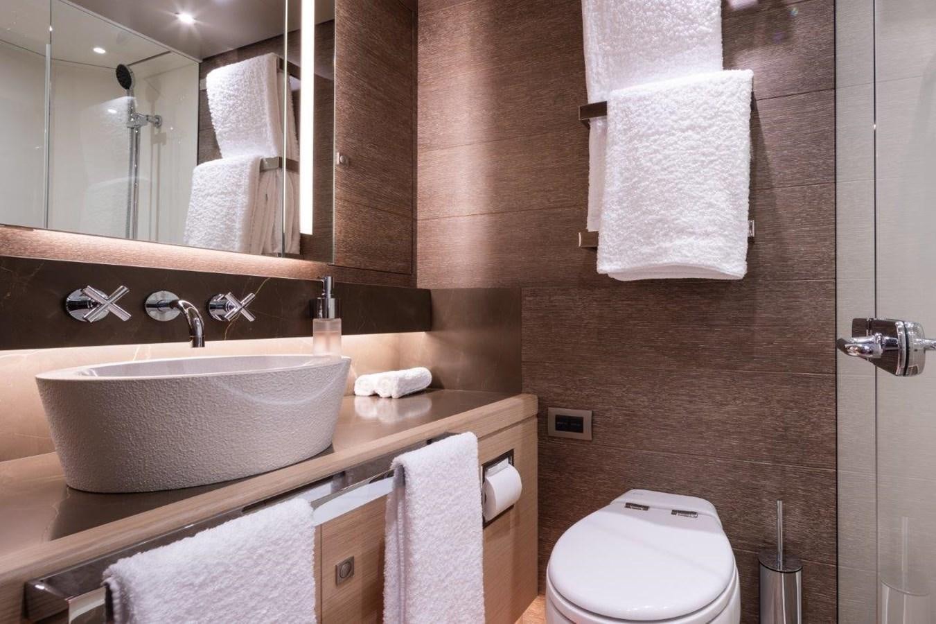 a bathroom with a sink and toilet aboard ALICE Yacht for Sale