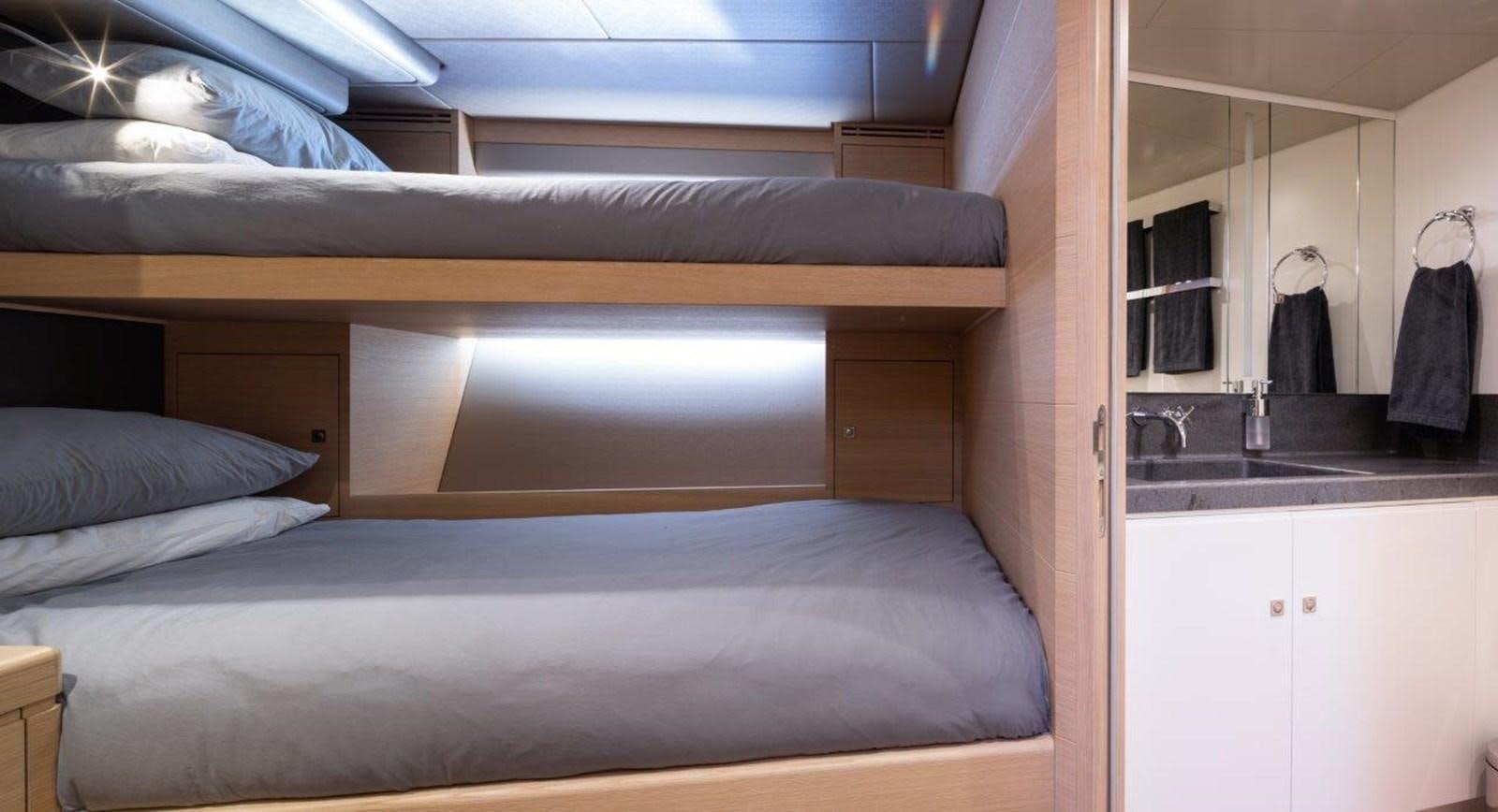 a bed in a room aboard ALICE Yacht for Sale