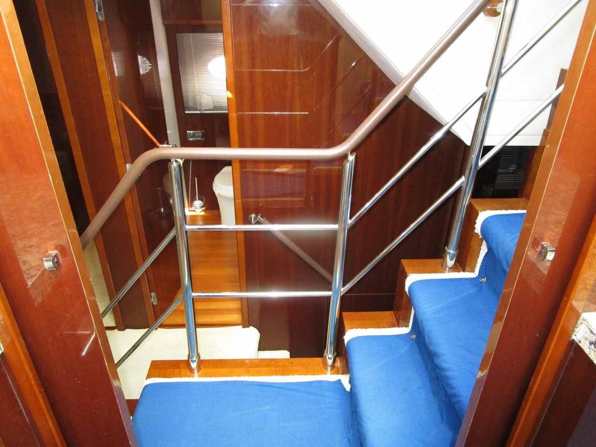 a staircase with a railing aboard MOJO II Yacht for Sale