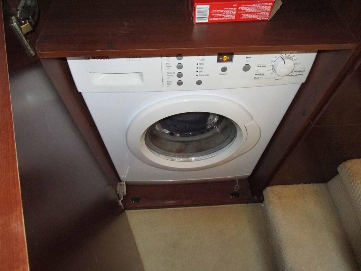 a washing machine with a vent aboard MOJO II Yacht for Sale