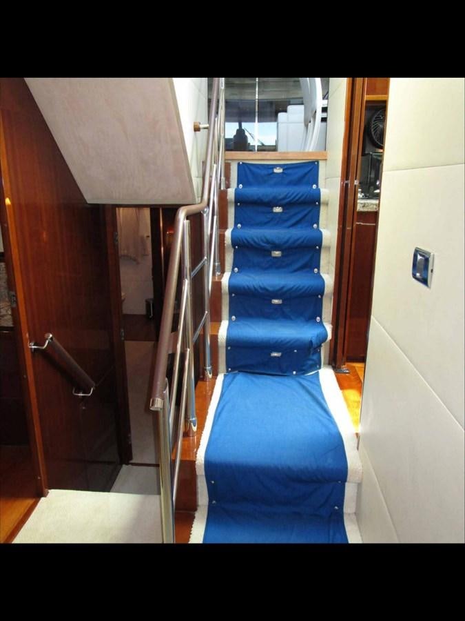a closet with a blue seat aboard MOJO II Yacht for Sale