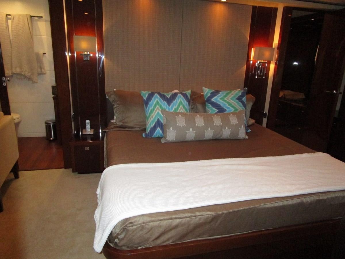 a bed with pillows on it aboard MOJO II Yacht for Sale