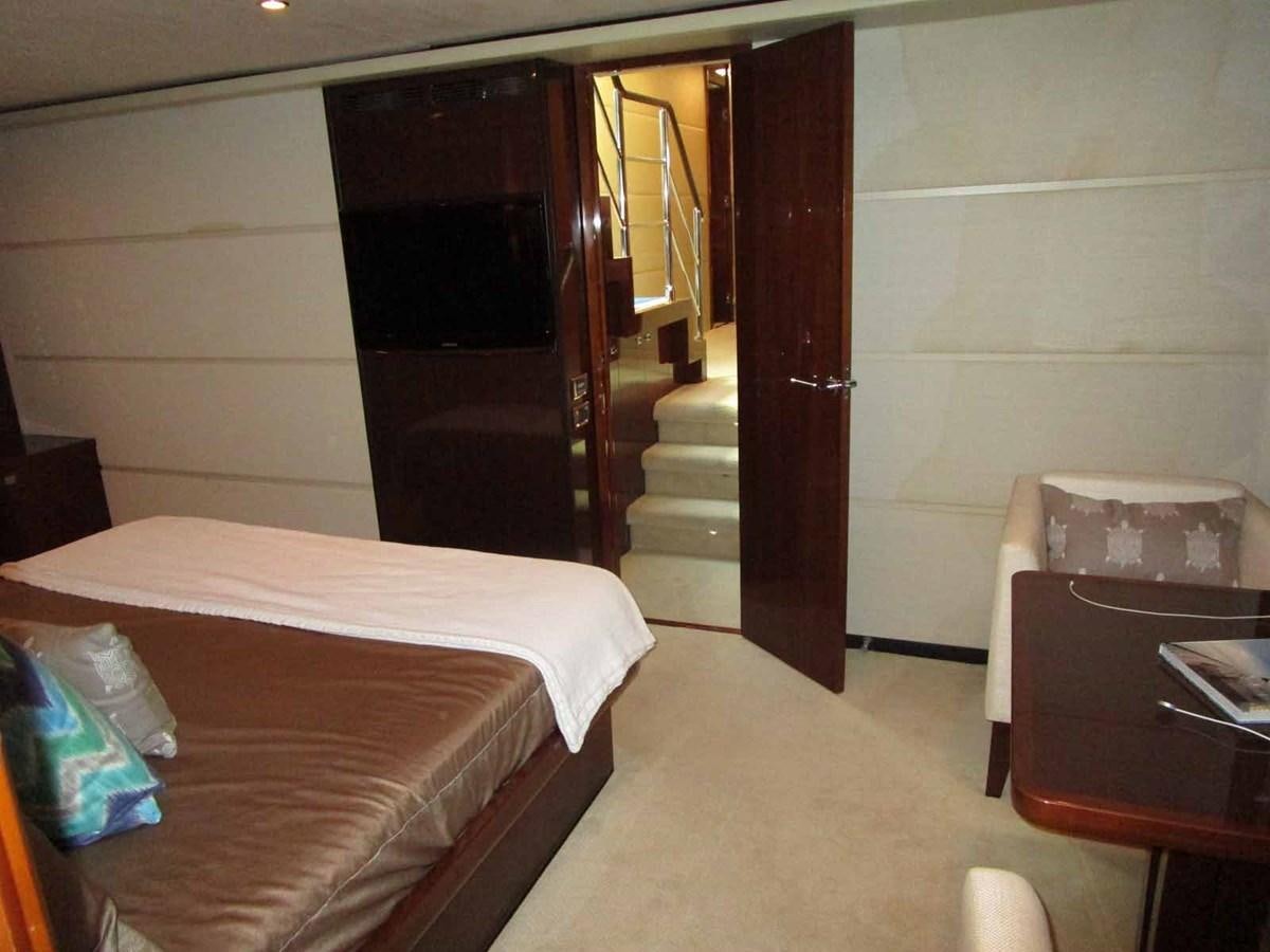 a hotel room with a bed and a table aboard MOJO II Yacht for Sale