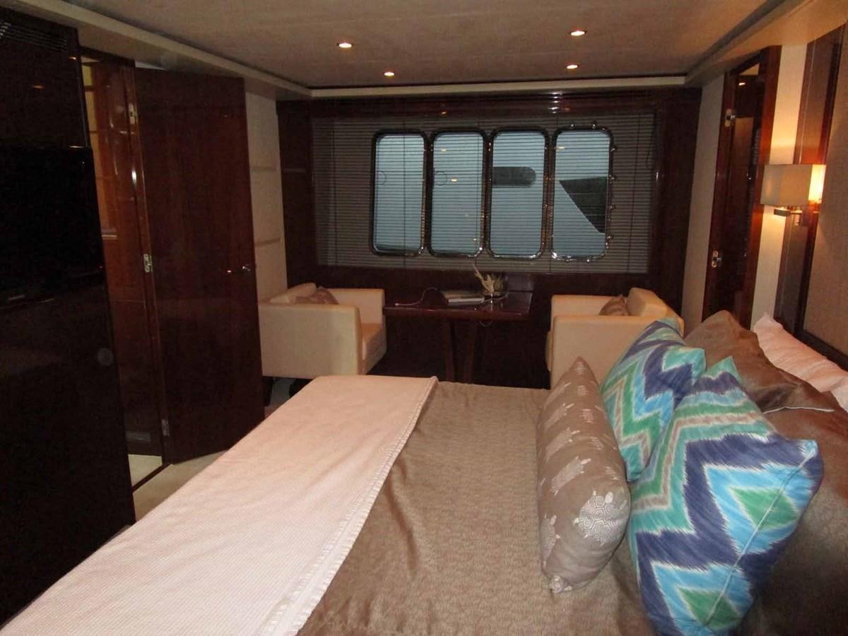 a room with a bed and a window aboard MOJO II Yacht for Sale