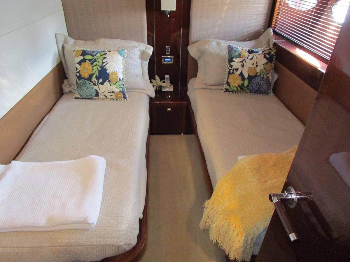 a room with two beds aboard MOJO II Yacht for Sale