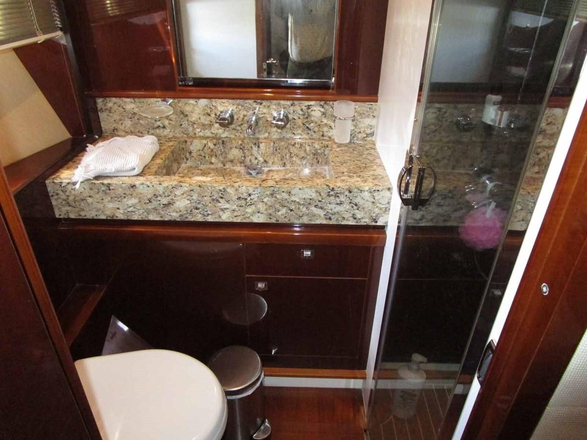 a bathroom with marble counter tops aboard MOJO II Yacht for Sale