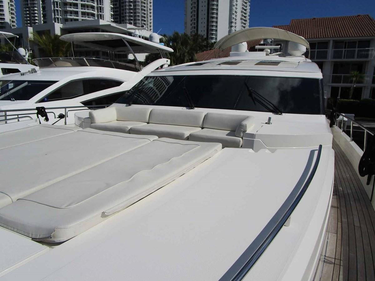 a white car parked on a deck aboard MOJO II Yacht for Sale
