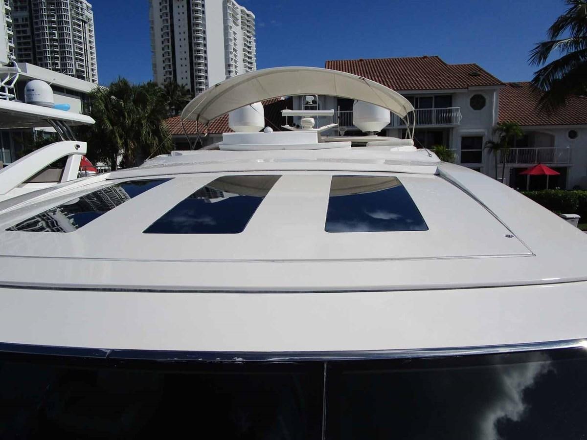 a white boat in a city aboard MOJO II Yacht for Sale
