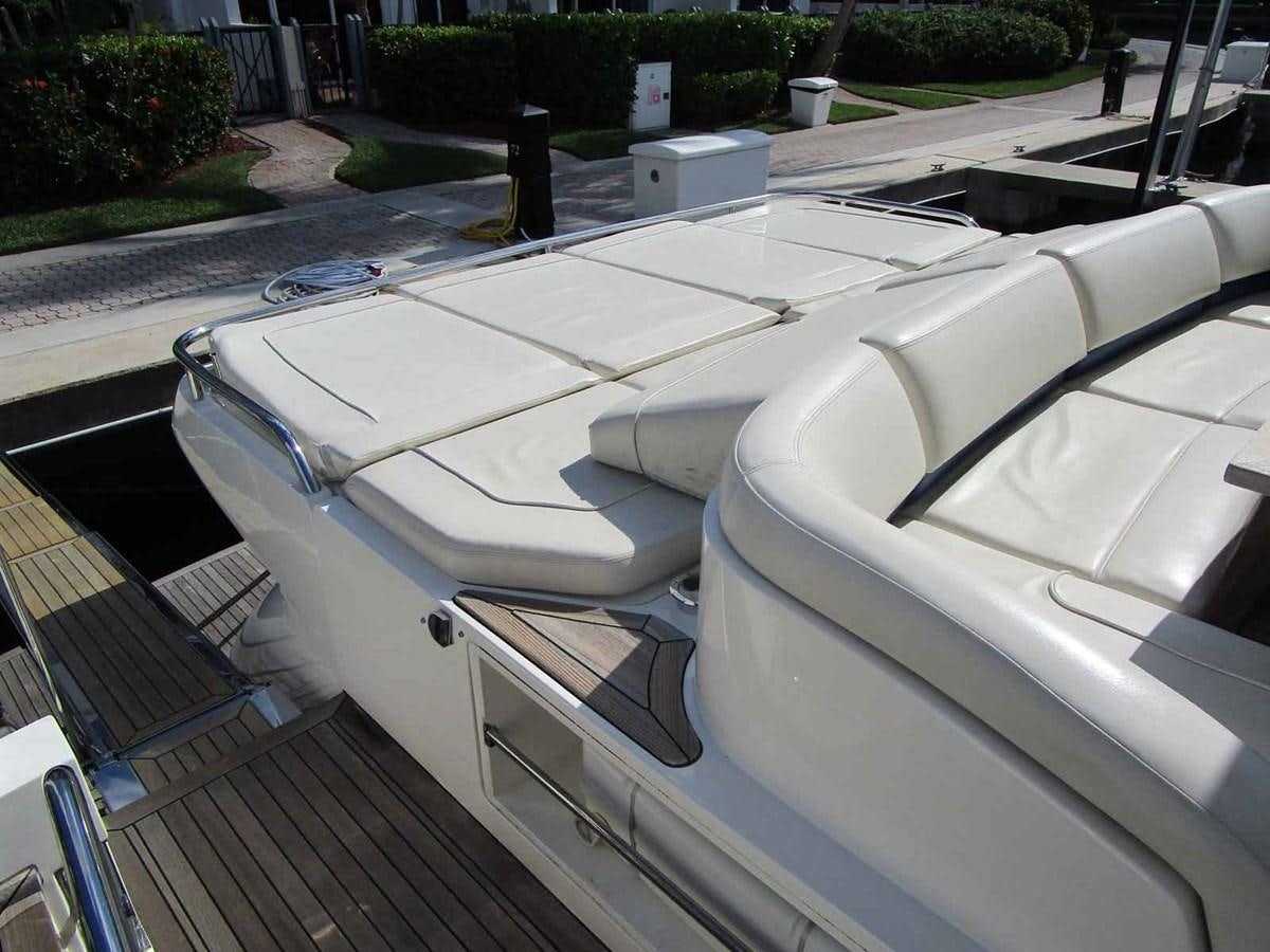 a white car parked on a driveway aboard MOJO II Yacht for Sale