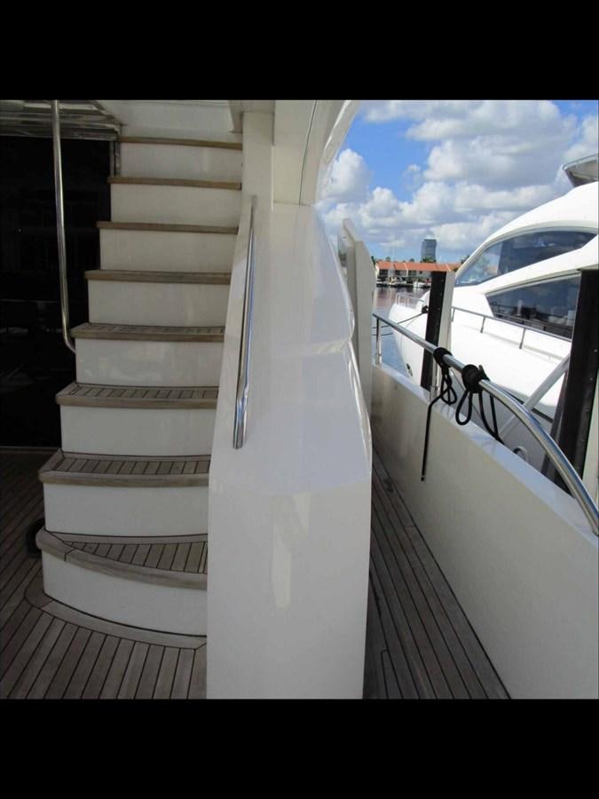 a white staircase with a white railing aboard MOJO II Yacht for Sale