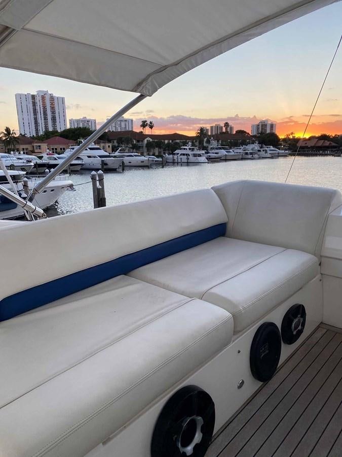a white car parked on a dock aboard MOJO II Yacht for Sale