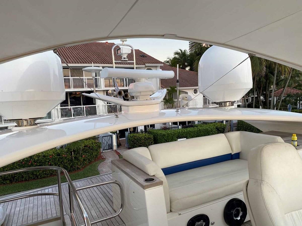 a white tent on a patio aboard MOJO II Yacht for Sale
