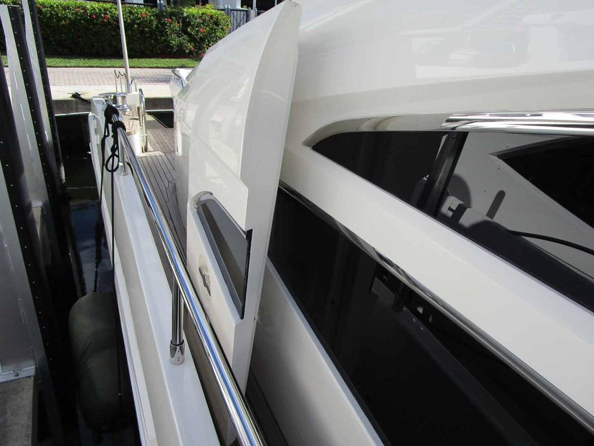 a car with a door open aboard MOJO II Yacht for Sale
