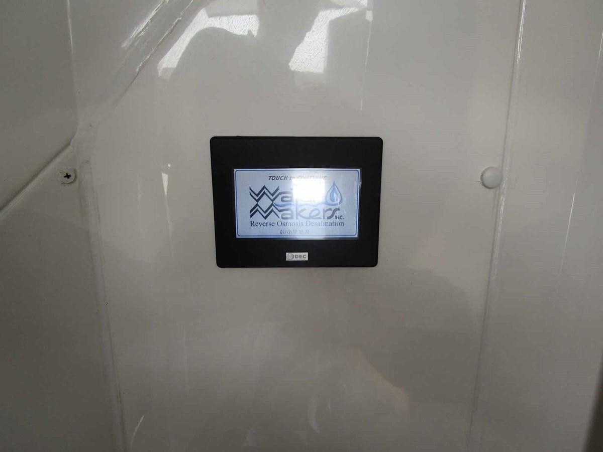 a digital clock on a wall aboard MOJO II Yacht for Sale